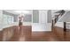 Elegant living room featuring hardwood floors, wainscoting, and a decorative chandelier at 2647 Brickell Sq, Atlanta, GA 30341
