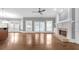 Bright living room boasts fireplace, hardwood floors, and abundant natural light from large windows at 2647 Brickell Sq, Atlanta, GA 30341