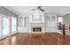 Spacious living room with hardwood floors, fireplace, built-ins, ceiling fan and french doors at 2647 Brickell Sq, Atlanta, GA 30341