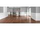 Expansive living area featuring hardwood floors, staircase with ironwork, and ample space at 2647 Brickell Sq, Atlanta, GA 30341