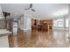 Open living space with hardwood floors, a fireplace, and a seamless transition into the kitchen at 2647 Brickell Sq, Atlanta, GA 30341