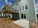 Beautiful backyard with deck, concrete patio and green siding on a two-story home at 41 Okeechobee Way, Braselton, GA 30548