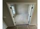 A spacious room with natural light streaming through the window and door with dark hardware at 41 Okeechobee Way, Braselton, GA 30548