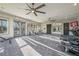 Modern gym with state-of-the-art fitness equipment, large windows, ceiling fans and a mirrored wall at 41 Okeechobee Way, Braselton, GA 30548
