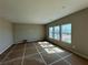 The living room features lots of natural light and ample space for entertaining guests at 41 Okeechobee Way, Braselton, GA 30548