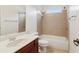 Well-lit bathroom featuring vanity and tiled shower with bathtub at 6945 W Mountain Xing, Cumming, GA 30041