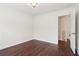 This airy bedroom offers hardwood floors and a staircase view at 6945 W Mountain Xing, Cumming, GA 30041
