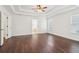 Large bedroom with hardwood flooring, a modern ceiling fan, and plenty of natural light at 6945 W Mountain Xing, Cumming, GA 30041