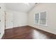 A bright bedroom features a vaulted ceiling and a large window view at 6945 W Mountain Xing, Cumming, GA 30041