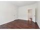 A spacious bedroom offers dark wood floors and flexible design options at 6945 W Mountain Xing, Cumming, GA 30041