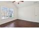 Vaulted bedroom featuring a ceiling fan and a large window at 6945 W Mountain Xing, Cumming, GA 30041