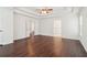 Spacious bedroom featuring hardwood floors, ceiling fan, and abundant natural light at 6945 W Mountain Xing, Cumming, GA 30041