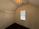 Walk-in closet with built-in shelving and racks, a window providing natural light, and hardwood flooring at 6945 W Mountain Xing, Cumming, GA 30041