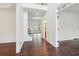 Elegant foyer featuring hardwood floors, staircase with iron railing, and decorative molding at 6945 W Mountain Xing, Cumming, GA 30041