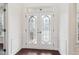 Stylish front door with decorative glass panels and bright white trim, inviting natural light at 6945 W Mountain Xing, Cumming, GA 30041