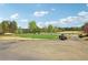 Picturesque golf course with lush green fairways, mature trees, and a tranquil pond at 6945 W Mountain Xing, Cumming, GA 30041