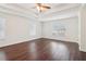 Spacious main bedroom features tray ceiling, hardwood floors, and natural light from two large windows at 6945 W Mountain Xing, Cumming, GA 30041