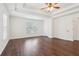 Spacious main bedroom with tray ceilings, hardwood floors, and natural light from large windows at 6945 W Mountain Xing, Cumming, GA 30041