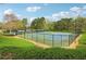 Beautiful tennis courts featuring a well-maintained playing surface, sturdy nets, and lush surroundings at 6945 W Mountain Xing, Cumming, GA 30041