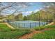 Community tennis courts featuring well-maintained courts, professional nets, and lush landscaping at 6945 W Mountain Xing, Cumming, GA 30041
