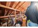 Spacious attic providing ample storage with exposed wooden beams and a variety of stored items at , Acworth, GA 30101