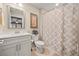 Well-lit bathroom featuring a shower-tub combination with neutral color scheme and patterns at , Acworth, GA 30101