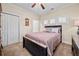 Cozy bedroom with neutral walls, ceiling fan, and plantation shutters at , Acworth, GA 30101