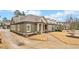 Craftsman-style home with green siding, white trim, and a well-manicured lawn at , Acworth, GA 30101