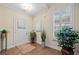 Inviting foyer with hardwood floors, plantation shutters, and decorative plants at , Acworth, GA 30101