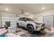 Organized garage featuring a SUV, storage cabinets, and ample space for parking and storage at , Acworth, GA 30101