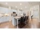 Bright kitchen features white cabinets, granite countertops, and a central island with bar seating at , Acworth, GA 30101