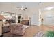 Cozy living room with hardwood floors, ceiling fan, and comfortable reclining sofa set at , Acworth, GA 30101