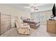 Cozy main bedroom features a ceiling fan, neutral colors, and comfortable seating at , Acworth, GA 30101