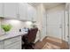 Efficient office space with granite counters, storage cabinets and a door to the outside at , Acworth, GA 30101