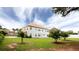 Spacious backyard with lush green grass and mature trees, perfect for outdoor activities at 1236 Saxony Se Dr, Conyers, GA 30013