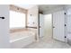 Bathroom featuring a soaking tub and a separate tiled shower at 1236 Saxony Se Dr, Conyers, GA 30013