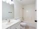 This bathroom features a shower-tub combo, white cabinets and a modern faucet at 1236 Saxony Se Dr, Conyers, GA 30013