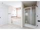 Bathroom with a tub and shower at 1236 Saxony Se Dr, Conyers, GA 30013