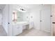 Ensuite bathroom featuring double sinks, tile floors and lots of vanity space at 1236 Saxony Se Dr, Conyers, GA 30013