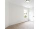 A sunlit bedroom is displayed with a window and modern decor for bright feel at 1236 Saxony Se Dr, Conyers, GA 30013