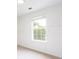 Bright bedroom featuring a large window and neutral decor at 1236 Saxony Se Dr, Conyers, GA 30013