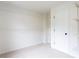 Spacious walk-in closet with built-in shelving for ample storage at 1236 Saxony Se Dr, Conyers, GA 30013