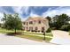 Charming two-story brick home featuring a manicured lawn and a long driveway at 1236 Saxony Se Dr, Conyers, GA 30013