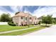 Attractive brick home with well-maintained lawn and mature trees in a neighborhood at 1236 Saxony Se Dr, Conyers, GA 30013