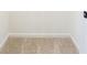 Neutral hallway is shown with plush carpeting, white walls, and baseboard trim at 1236 Saxony Se Dr, Conyers, GA 30013