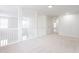 Hallway with carpet flooring, neutral paint, and white railing at 1236 Saxony Se Dr, Conyers, GA 30013