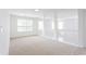 Upstairs hallway with carpet flooring, neutral paint, and natural light at 1236 Saxony Se Dr, Conyers, GA 30013