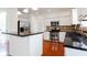 Bright kitchen with stainless steel appliances, granite countertops and hardwood floors at 1236 Saxony Se Dr, Conyers, GA 30013