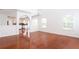 Open floor plan showcasing hardwood floors, archways, and kitchen access at 1236 Saxony Se Dr, Conyers, GA 30013