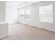 Bright and airy main bedroom featuring a large window overlooking trees at 1236 Saxony Se Dr, Conyers, GA 30013